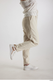 Yeva  1 beige pants casual dressed flexing leg side…